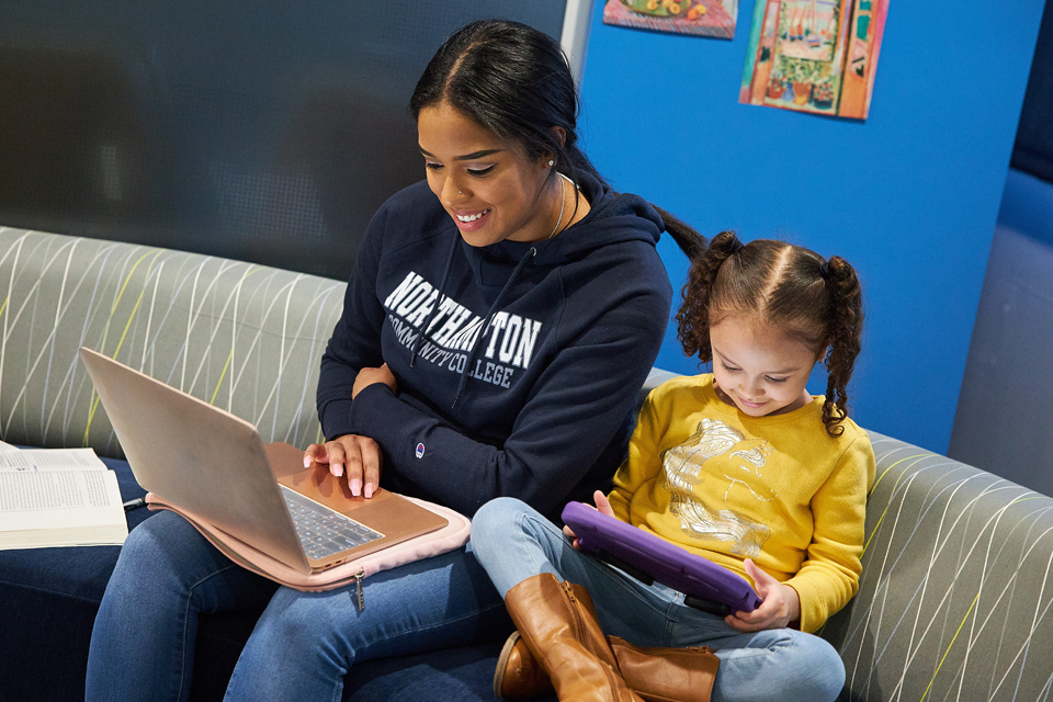 student and her daughter on computer